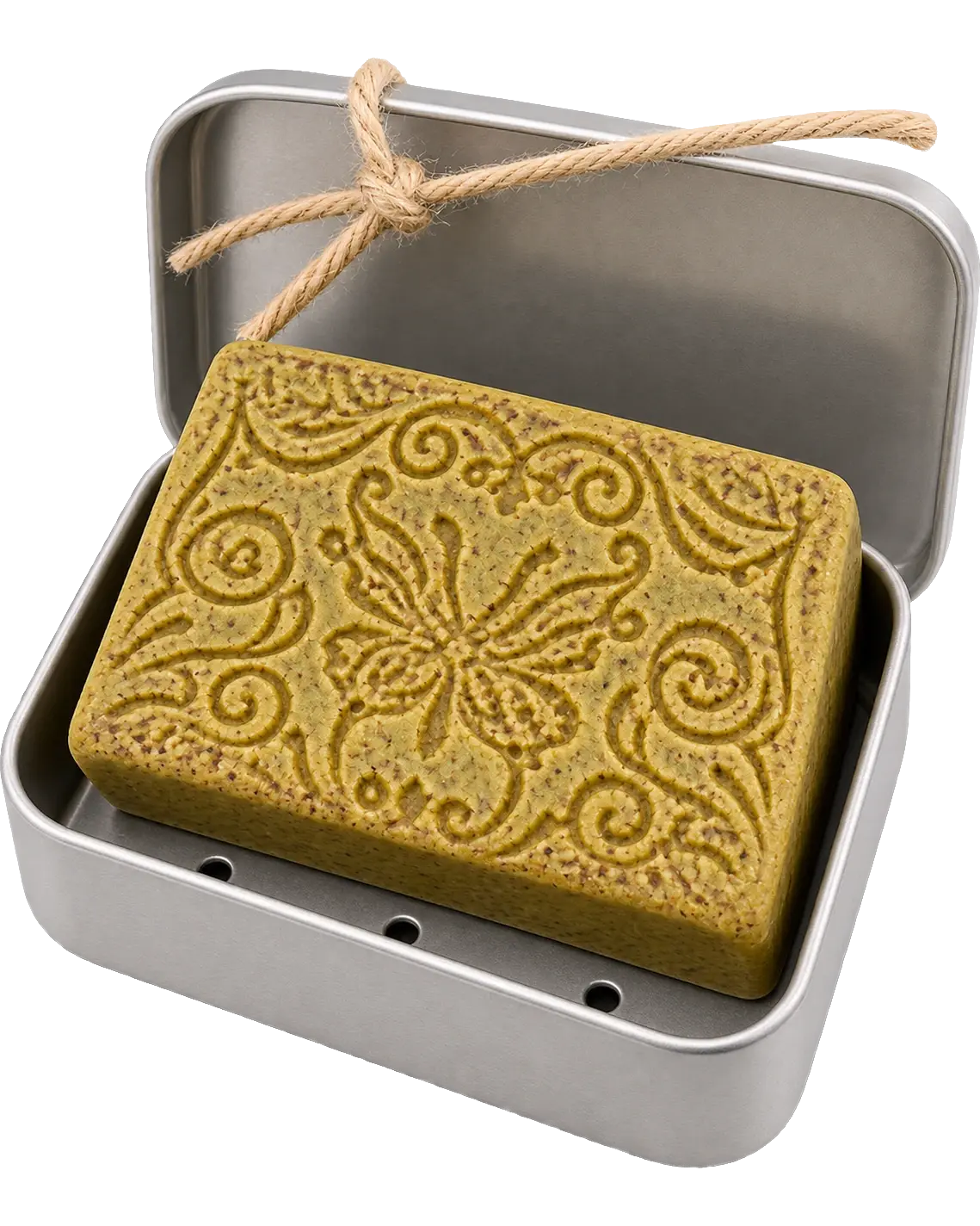 Jabonera abierta con la pastilla de jabón verde, grabada con un motivo floral